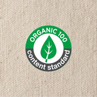 Organic content standard label on a beige fabric background